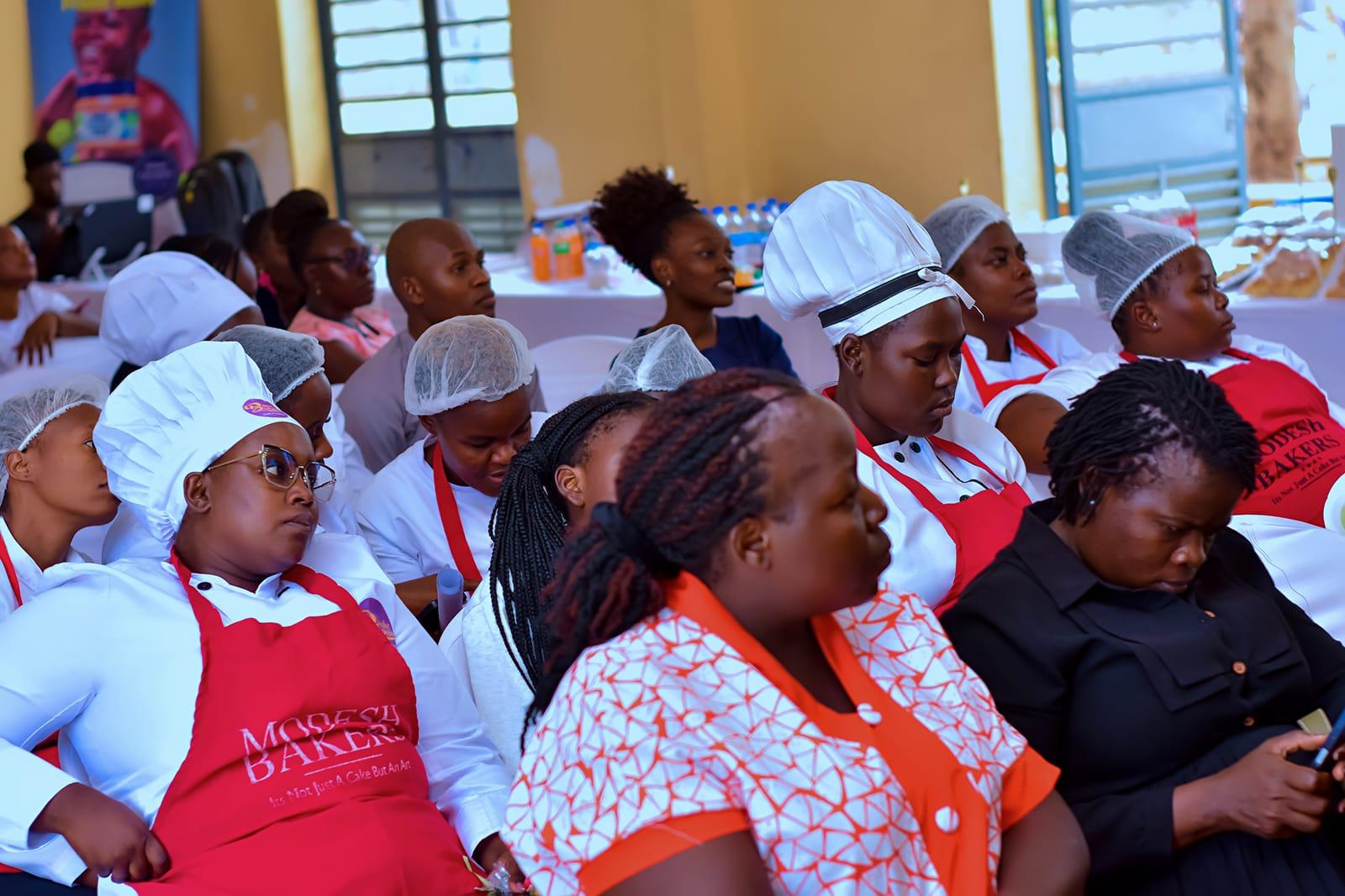 Modesh Empowerment Hub trainees seated together at a baking masterclass